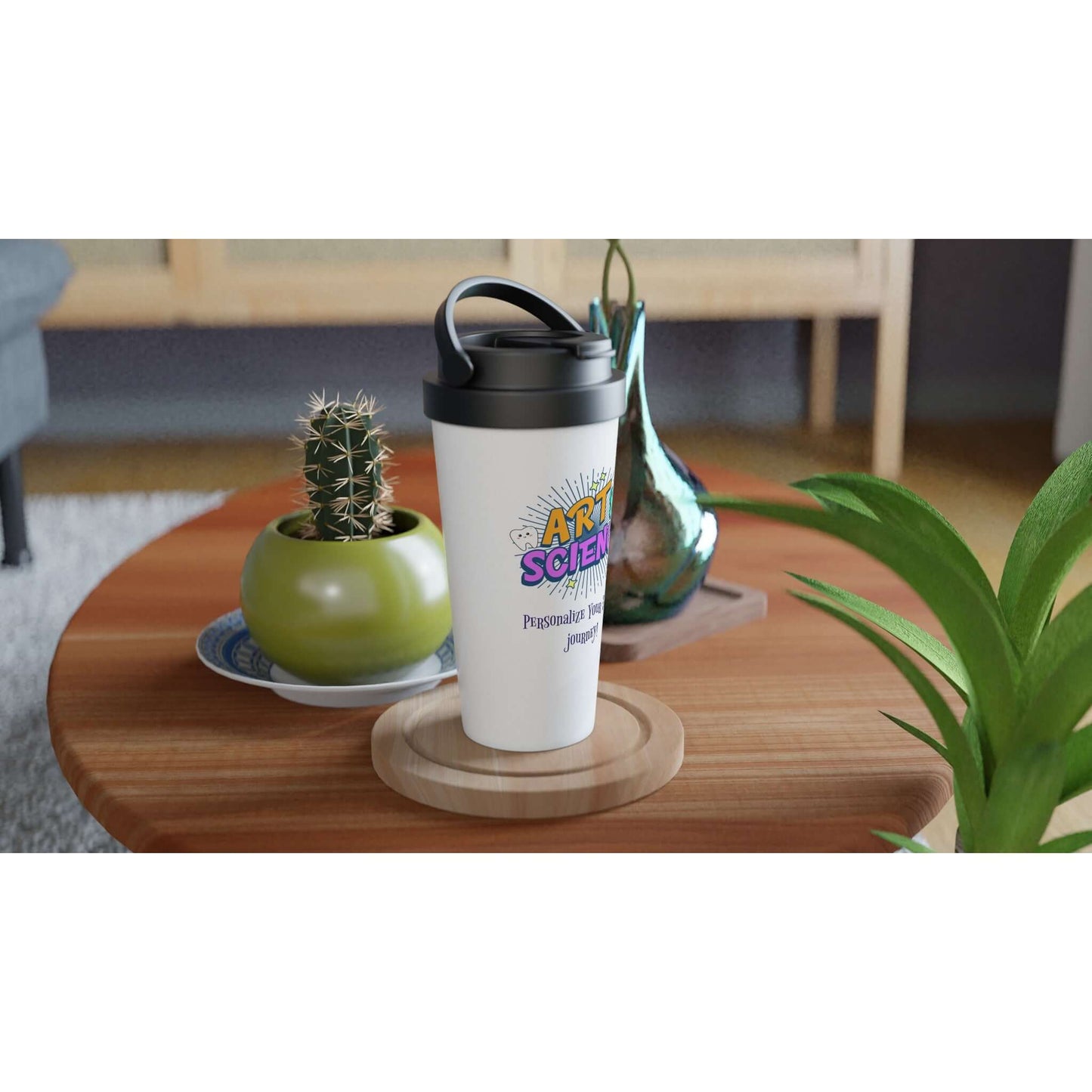 Art & Science personalized 15oz stainless steel travel mug on a wooden table surrounded by plants and decor.