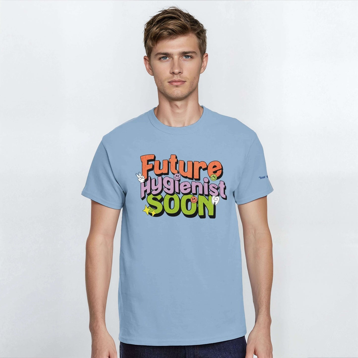 Model wearing a blue Future Hygienist Soon Personalized Heavyweight Unisex Crewneck T-Shirt with colorful text.
