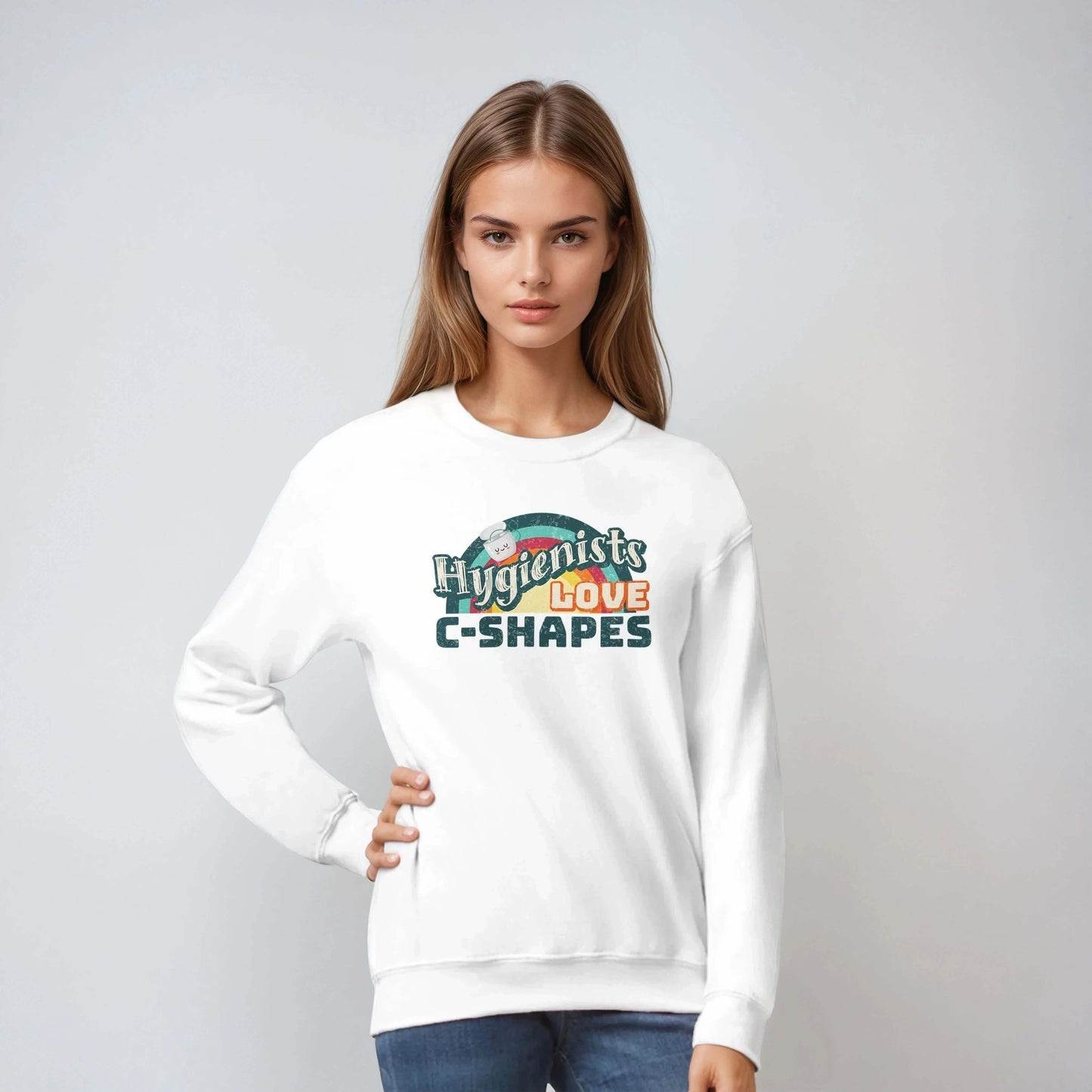 Model wearing Hygienists LOVE C-Shapes personalized crewneck sweatshirt in white, showcasing playful dental pride design.