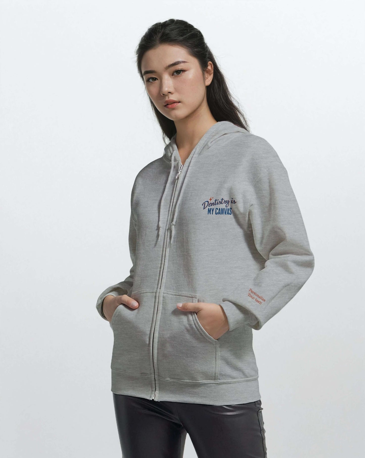 Model wearing a Personalized Classic Unisex Zip Hoodie – Dentistry is My Canvas, featuring elegant embroidery.
