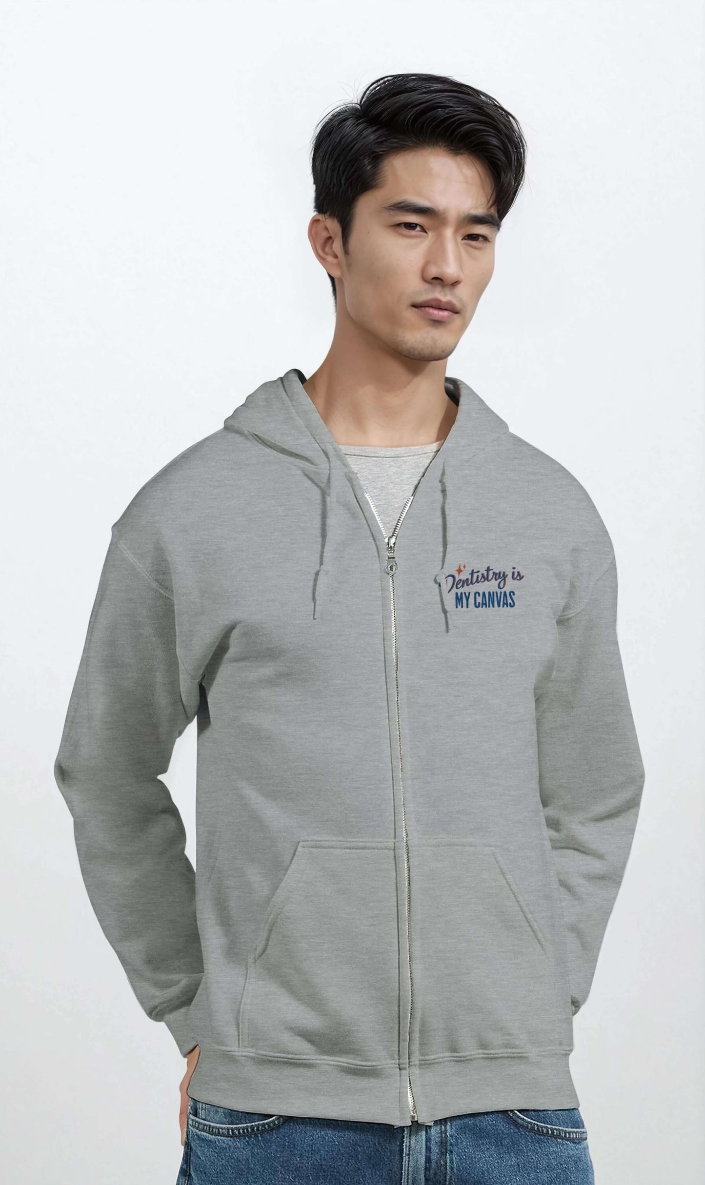 Personalized Classic Unisex Zip Hoodie - Dentistry is My Canvas in grey, stylishly worn by a man.
