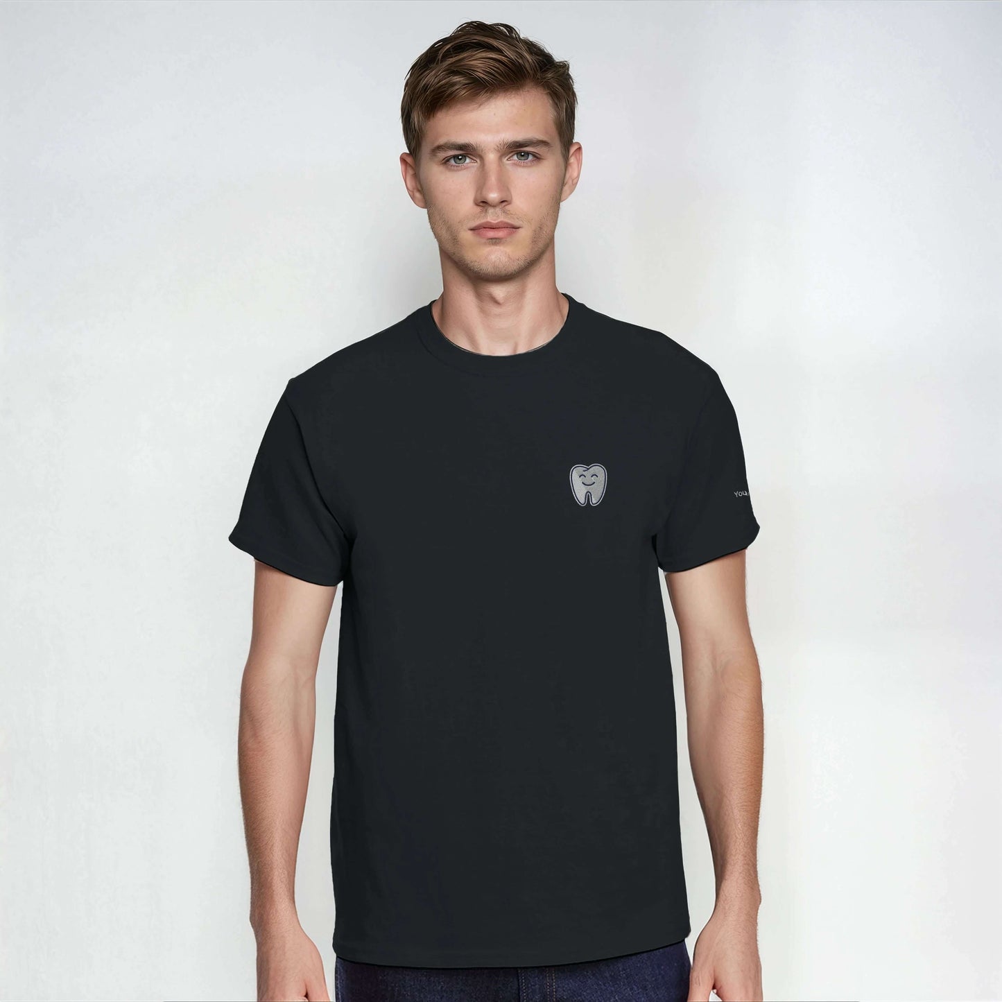 Personalized Heavyweight Unisex Crewneck T-Shirt with Smiling Tooth Embroidery in black color.