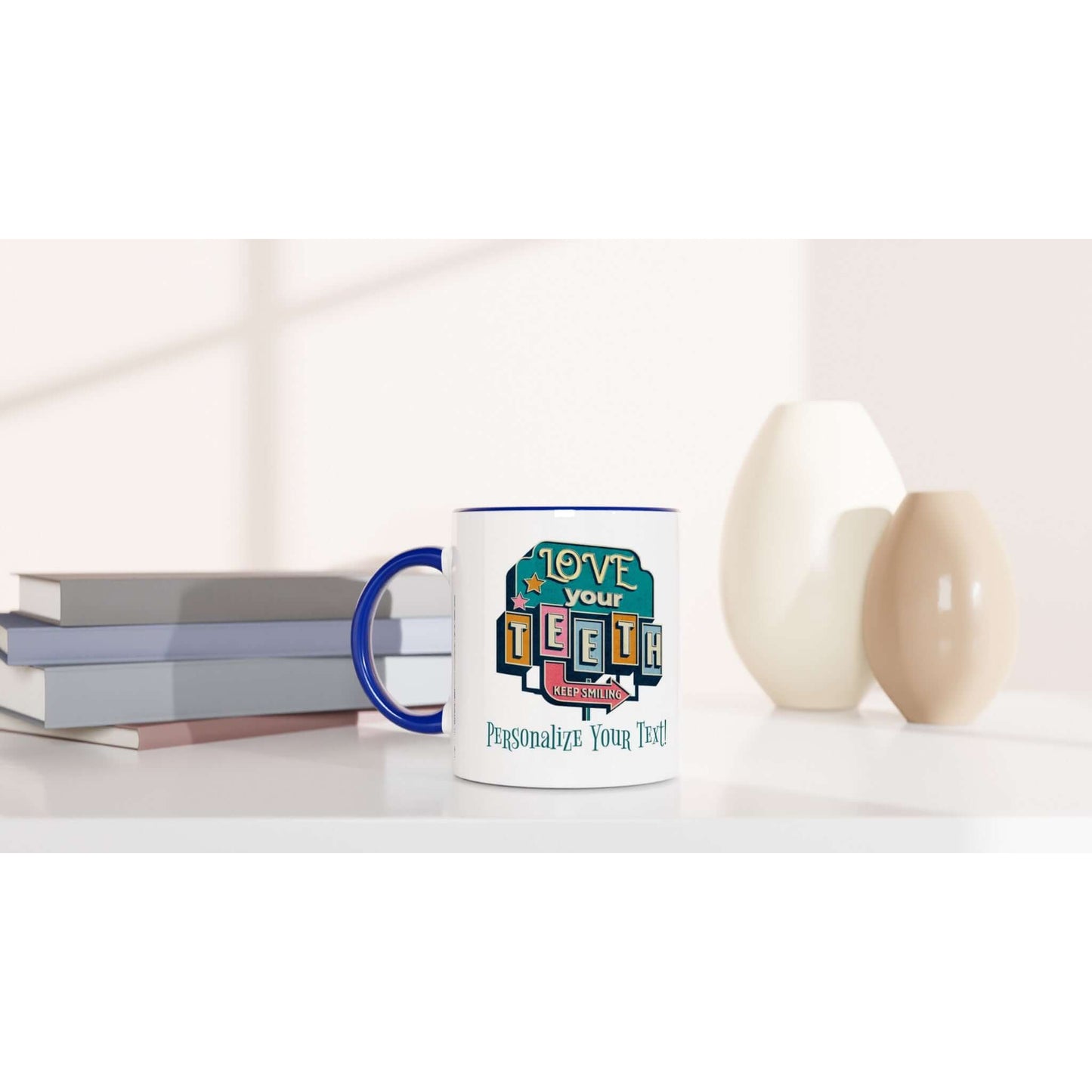 Personalized “Love Your Teeth” Ceramic Mug on a table next to stacked books and decorative vases.