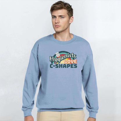 Man wearing Hygienists LOVE C-Shapes personalized crewneck sweatshirt in light blue.