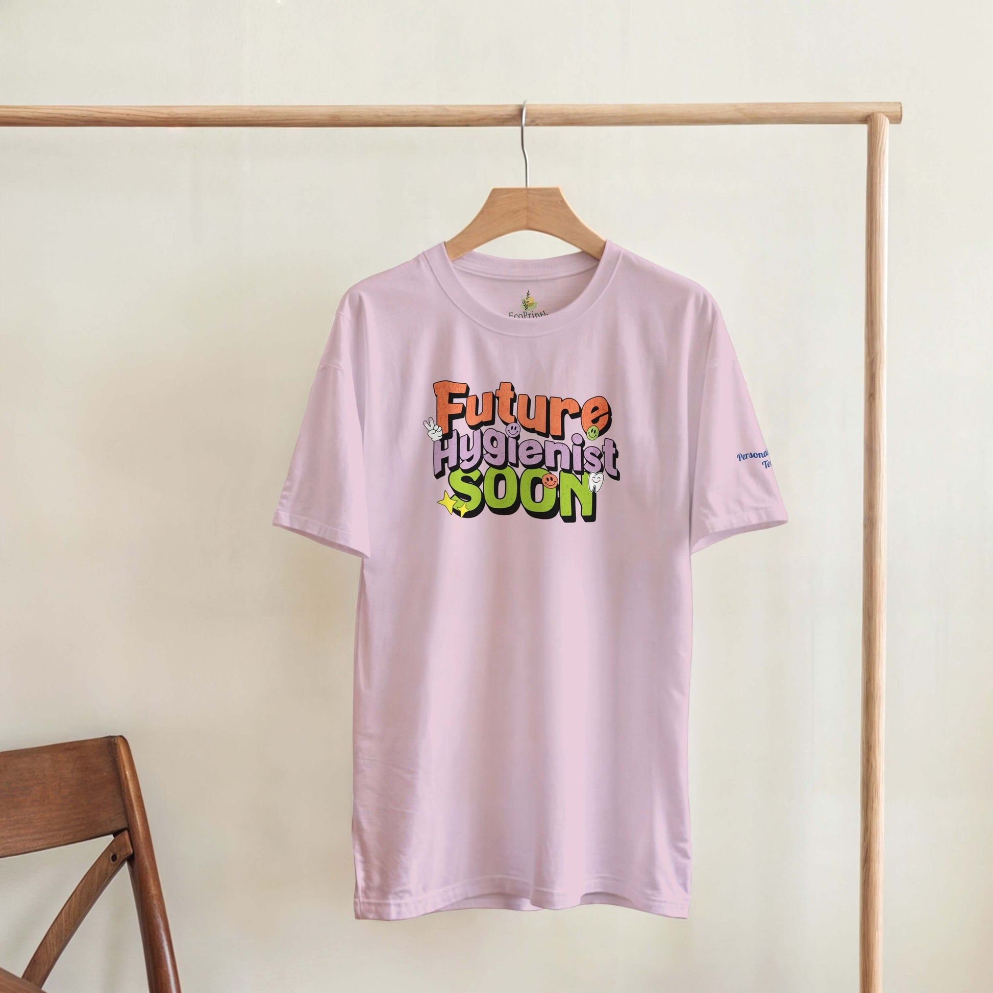 Future Hygienist Soon personalized heavyweight unisex crewneck t-shirt hanging on display.