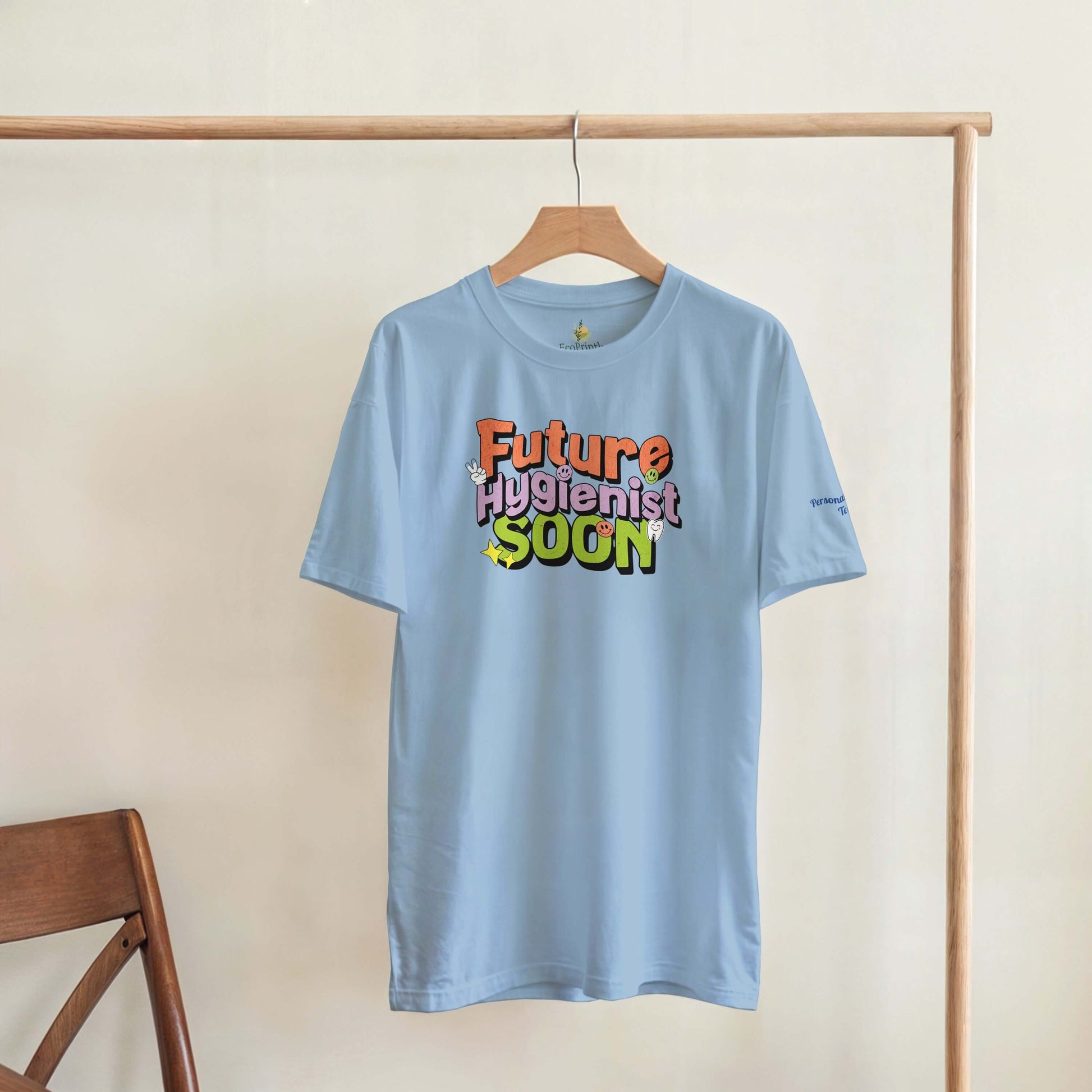 Future Hygienist Soon personalized heavyweight unisex crewneck T-shirt in light blue hanging on display.