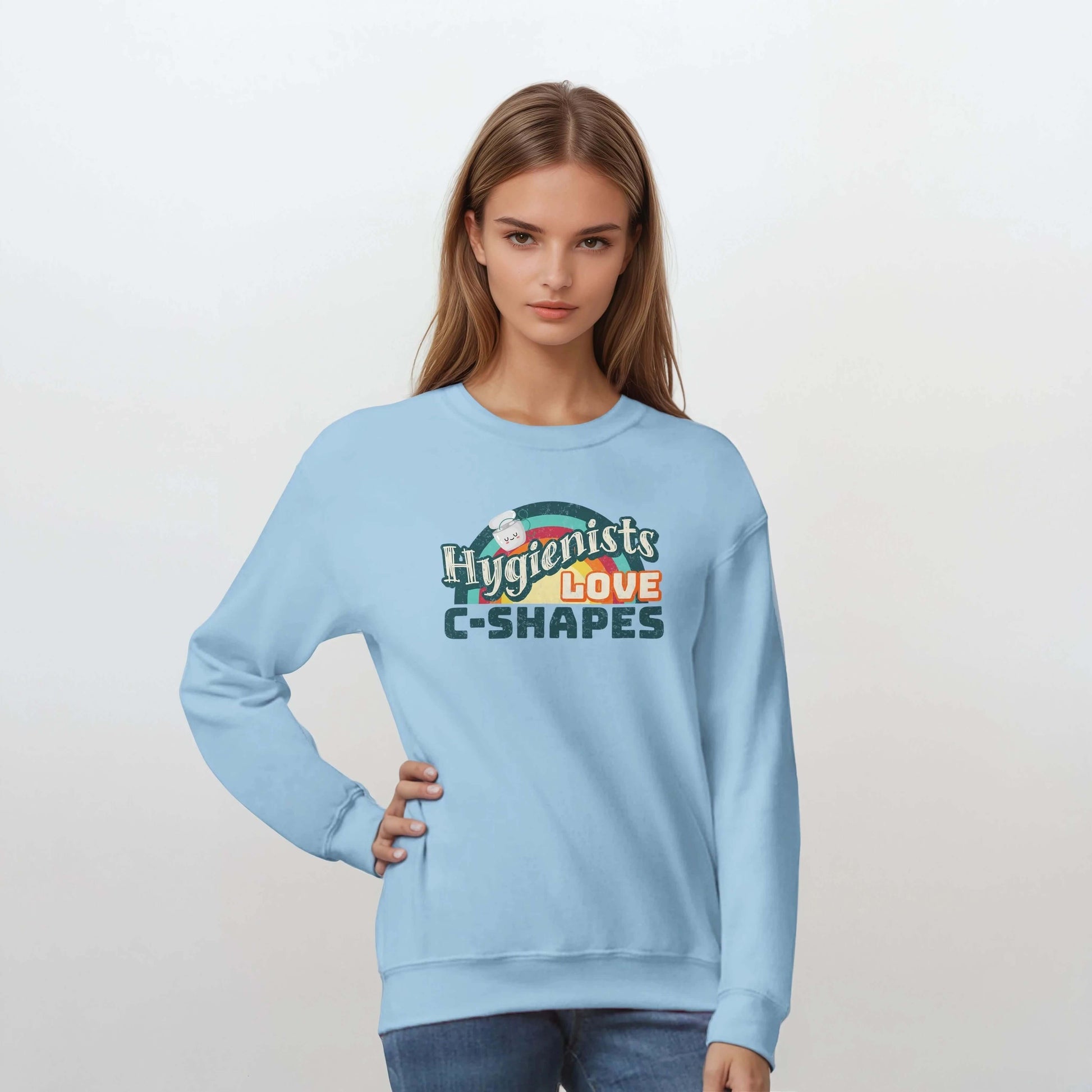 Model wearing a light blue Hygienists LOVE C-Shapes sweatshirt, showcasing the playful graphic design.