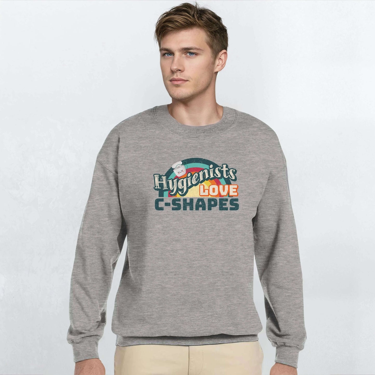 Man wearing a gray sweatshirt with 'Hygienists LOVE C-Shapes' graphic on the front.
