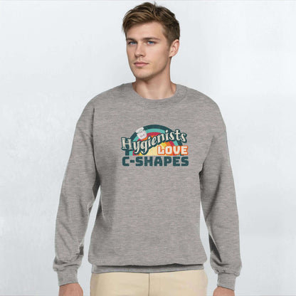 Man wearing a gray sweatshirt with 'Hygienists LOVE C-Shapes' graphic on the front.