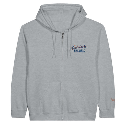 Personalized Classic Unisex Zip Hoodie in gray with 'Dentistry is My Canvas' embroidery on the chest.