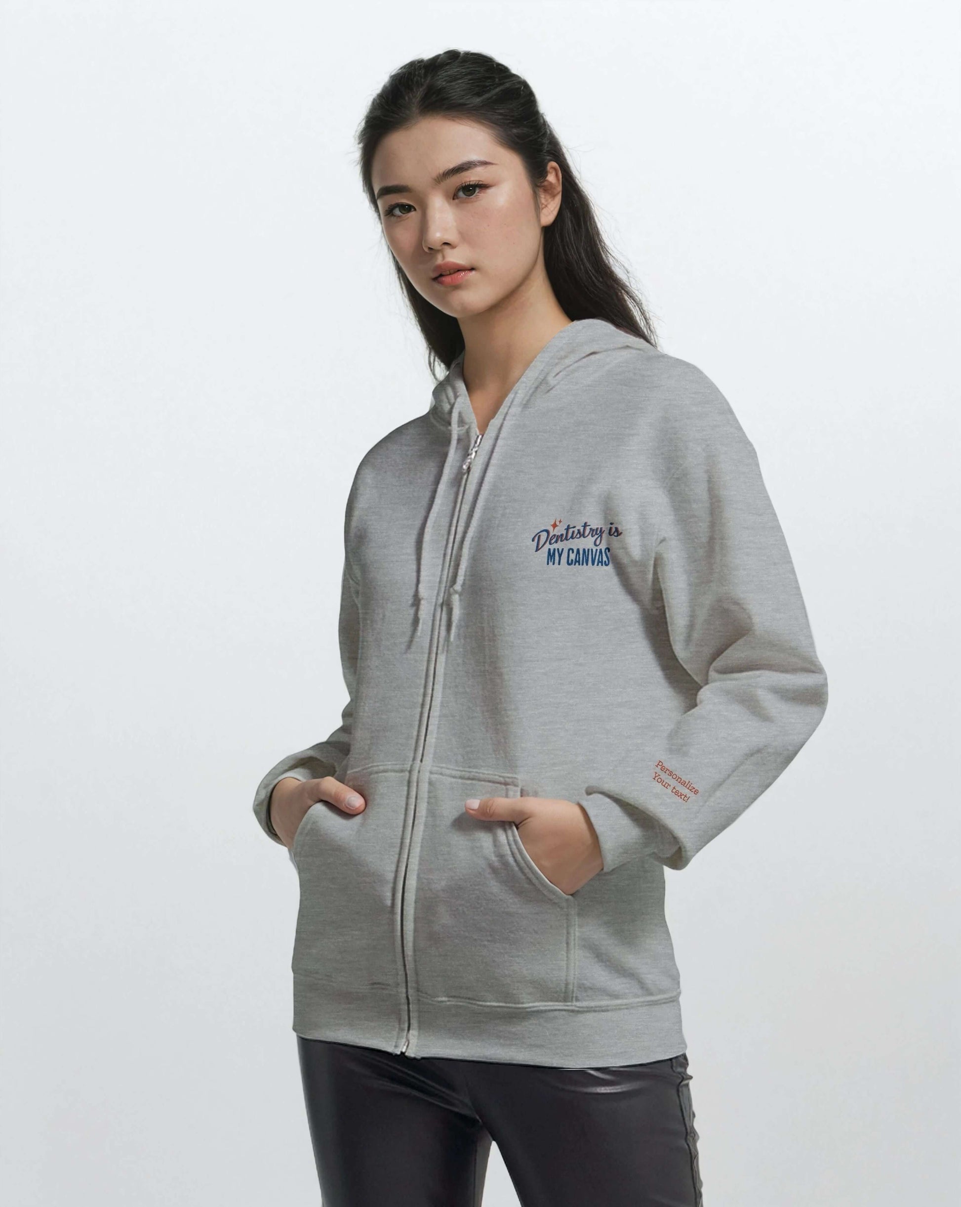 Model wearing a Personalized Classic Unisex Zip Hoodie – Dentistry is My Canvas, featuring elegant embroidery.