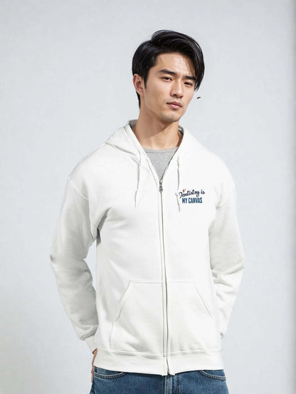 Personalized Classic Unisex Zip Hoodie in white with 'Dentistry is My Canvas' embroidery on chest.