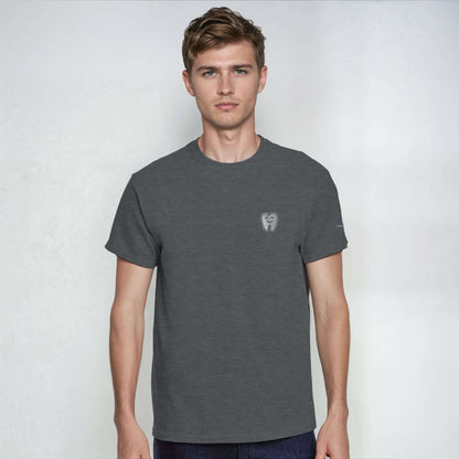 Model wearing a Personalized Heavyweight Unisex Crewneck T-Shirt with Smiling Tooth Embroidery in dark gray.