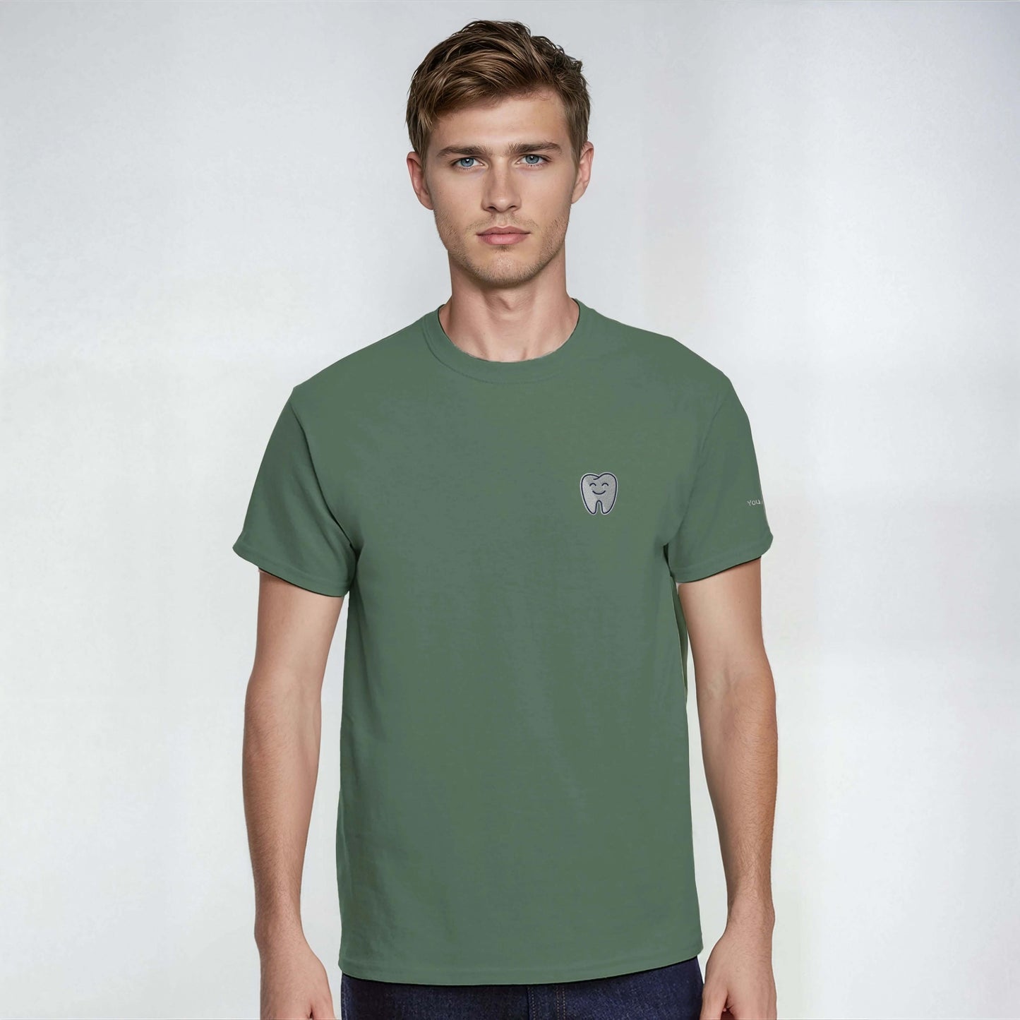 Personalized Heavyweight Unisex Crewneck T-Shirt with Smiling Tooth Embroidery in green color.