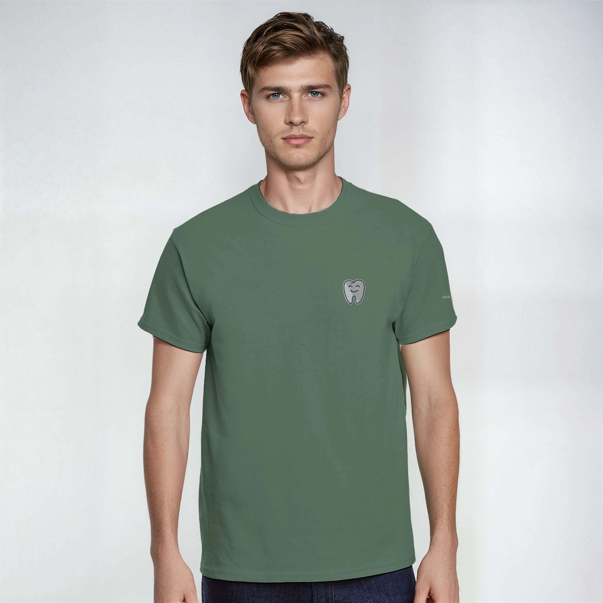 Personalized Heavyweight Unisex Crewneck T-Shirt with Smiling Tooth Embroidery in green color.