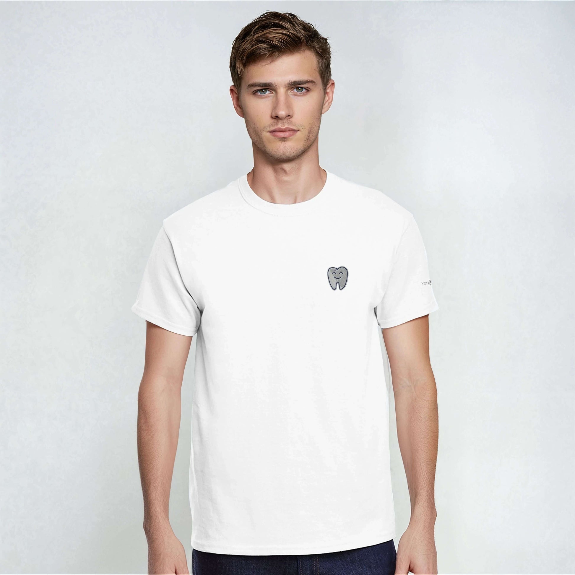 Personalized Heavyweight Unisex Crewneck T-Shirt with Smiling Tooth Embroidery in white, model wearing the tee.