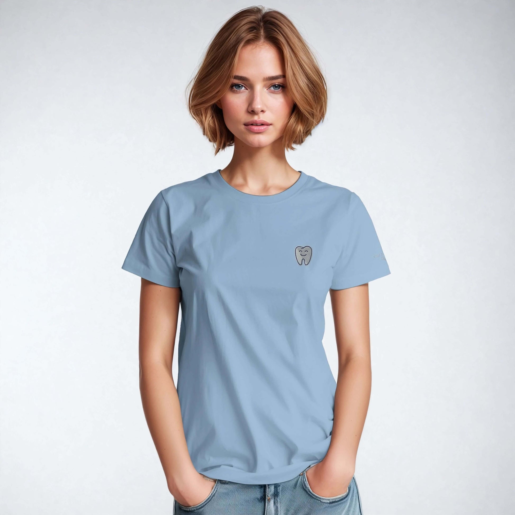 Personalized Heavyweight Unisex Crewneck T-Shirt in light blue with Smiling Tooth Embroidery on the chest.